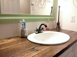 If the bathroom vanity doesn't come with an attached counter, you can secure the vanity top to the cabinet with a thin bead of caulk. Rustic Wood Vanity Top Diy Bathroom Makeover Rustic Bathroom Vanities Diy Bathroom