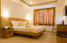 a bed or beds in a room at fabhotel prime royal castle gandhipuram