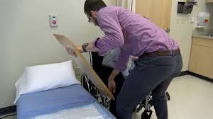 how to transfer a paralyzed patient