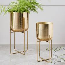 Display all the beauty of your plants and flowers with planters and plant stands. Standing Planters For Lightweight And Airy Displays Of Greenery