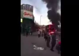 migrant setting fire to a london bus