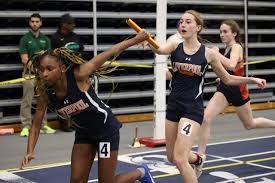 indoor track and field athletes compete