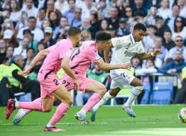 real madrid beat cadiz to move top in