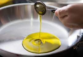 Can olive oil be used to season a nonstick pan?