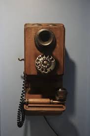 Old Vintage Phone Hanging On Wall Stock