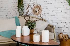 White Candles On Wooden Coffee Table In