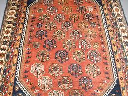 old tribal style rug shiraz region