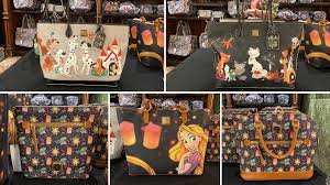Dooney and bourke disney cats purse. Photos New Disney Dogs Cats And Tangled Dooney Bourke Bags Arrive At Walt Disney World Wdw News Today