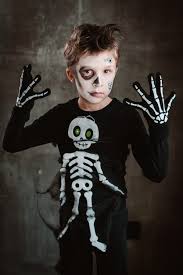 little boy child in skeleton costume