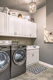Simple Laundry Room With White Cabinets