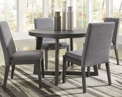 What are round dining furniture sets made from? Besteneer Dark Gray 5 Pc Round Dining Room Table 4 Upholstered Side Chairs Mathis Brothers Furniture