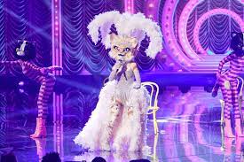 One blue and one amber. Masked Singer Recap Kitty Eliminated Unveiled As Young Singer Ew Com