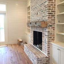 reclaimed wood mantle beam and brick