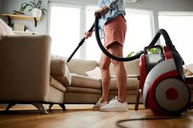 cleaning sofa with vacuum cleaner