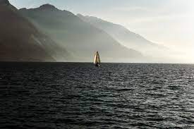 wallpaper sailboat on sea near mountain