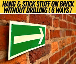 Watch here and learn how to drill then watch our video on how to hang things on a brick cement wall here. How To Hang Stick Stuff On Brick Wall Without Drilling
