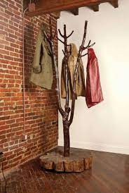 Use a found tree branch and some basic tools to craft this simple, rustic coat rack. 30 Diy Tree Coat Racks Personalizing Entryway Ideas With Inspiring Designs Tree Coat Rack Branch Decor Diy Tree