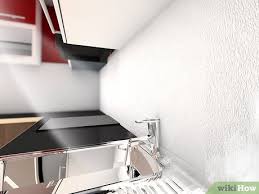 Tape off the existing countertop or backsplash and the underside of the cabinets to protect those surfaces. How To Install A Kitchen Backsplash With Pictures Wikihow
