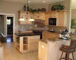 is greenery above kitchen cabinets