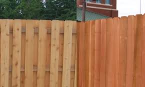 cedar fence vs redwood fencing which