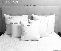 decorative pillows on a queen bed