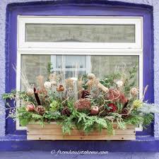 diy winter window bo with evergreens