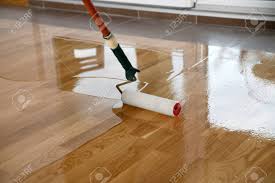 Are you a flooring contractor? Lacquering Wood Floors Worker Uses A Roller To Coating Floors Varnishing Lacquering Parquet Floor By Paint Roller Second Layer Home Renovation Parquet Stock Photo Picture And Royalty Free Image Image 121735645