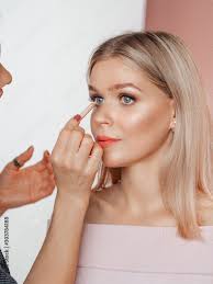 make up artist working in makeup studio