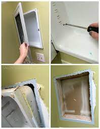 removing the existing medicine cabinet
