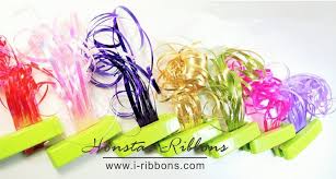 Hold the ribbon ends to the dowel or skewer with metal binder clips. How To Use Ribbon Shredder And Curler Tool For Gift Wrapping