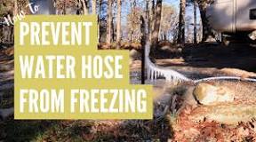 How do I keep my RV water hose from freezing?