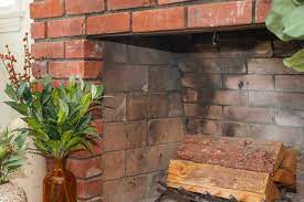 how to clean soot off brick fireplaces