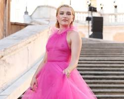Florence Pugh in a neon pink feathered dress by Halpern