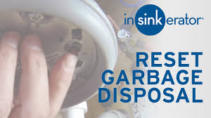 how to reset garbage disposal