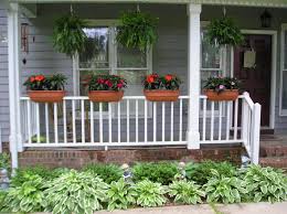 Hanging on a small upper level balcony, upon a rustic wrought iron railing, we see a pair of small containers housing flower boxes. Balcony Railing Planter Ideas Novocom Top