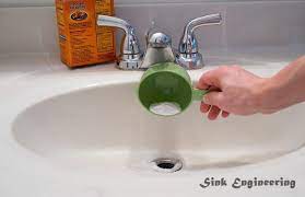 get rid of black sludge in sink drain