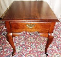 The legs are softly curved with a scrolled apron, and soft paw feet. Vintage Broyhill Lenoir Cherry Queen Anne Side End Tables Drawers Pair 371788820