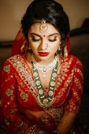 photo of bridal makeup with red lehenga