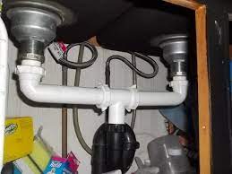 to unclog a double kitchen sink drain