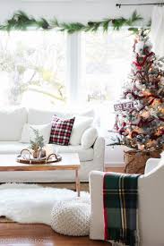 By balancing the red with whites and blues, the room stands out without being overwhelming. Red White Christmas Decorating New Living Room Tour The Happy Housie