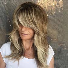 They automatically add texture to johnson's signature bangs are her most recognizable feature. 23 Stylish Feathered Hair Cuts For All Lengths Stayglam