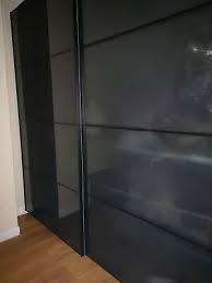 ikea pax wardrobe with black glass