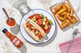 frank s redhot sauce drizzled hot dogs
