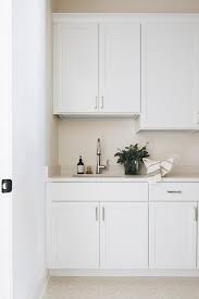 white cabinets with cream countertops