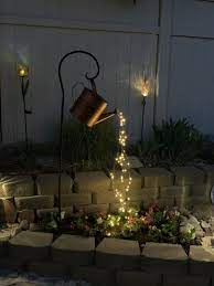 watering can decor with lights