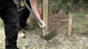 how to install a fence post into soil