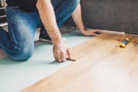 install wood flooring over carpet