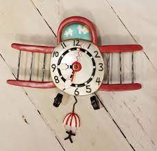 airplane clock with man pendulum cahoots