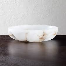 Good availability and great rates. Oyster Alabaster Catchall Cb2