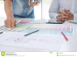 Two Interior Design Or Graphic Designer At Work On Project
